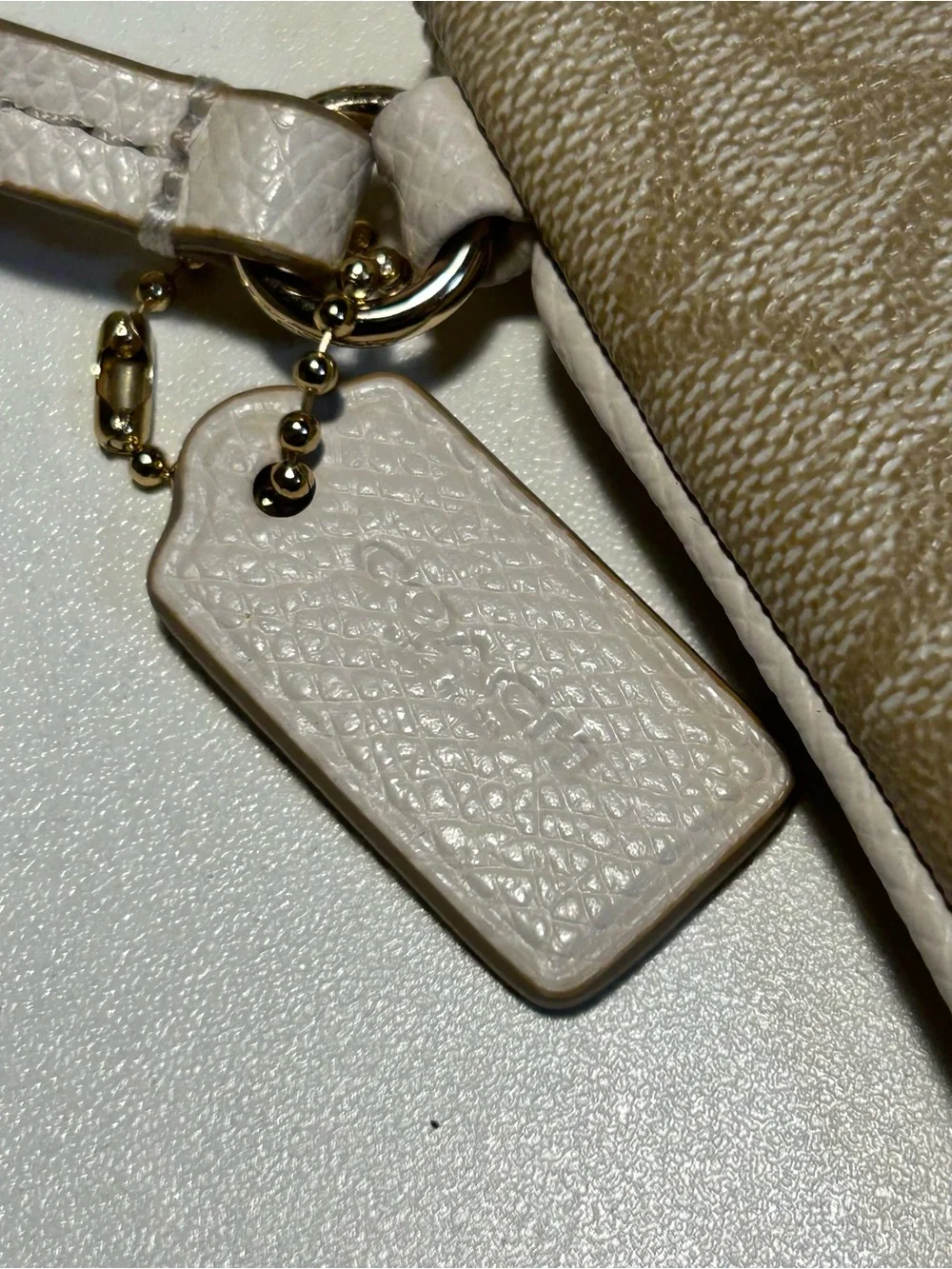 Coach Signature Canvas Zip Wristlet in Neutral Khaki Cream includes hang tag